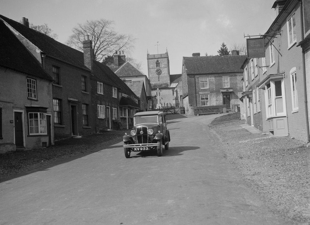 Detail of Standard Sixteen saloon driving down the High Street, Hambledon, Hampshire, 1930s by Bill Brunell