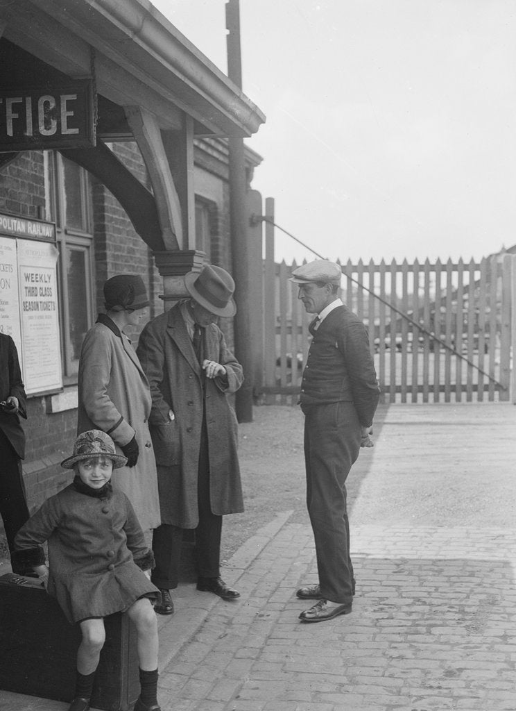 Detail of Group of people outside a Metropolitan Line railway station, London, 1930s. by Bill Brunell