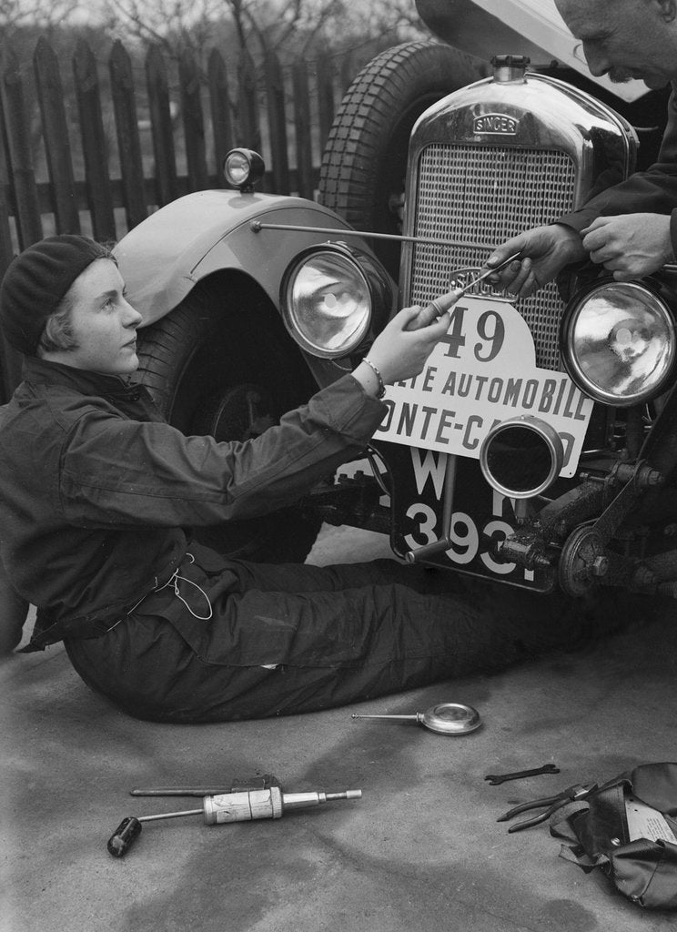 Detail of Kitty Brunell working on her Singer Junior, Monte Carlo Rally, 1928 by Bill Brunell