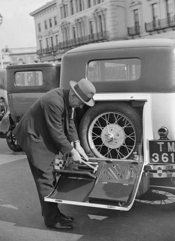 Detail of A driver opening the fitted toolkit of his Ford Model A at the Southport Rally, 1928 by Bill Brunell
