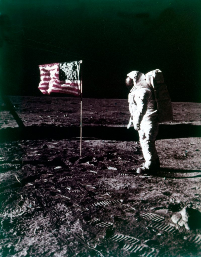 Detail of Buzz Aldrin stands next to the American flag on the surface of the Moon, July 1969 by Neil Armstrong