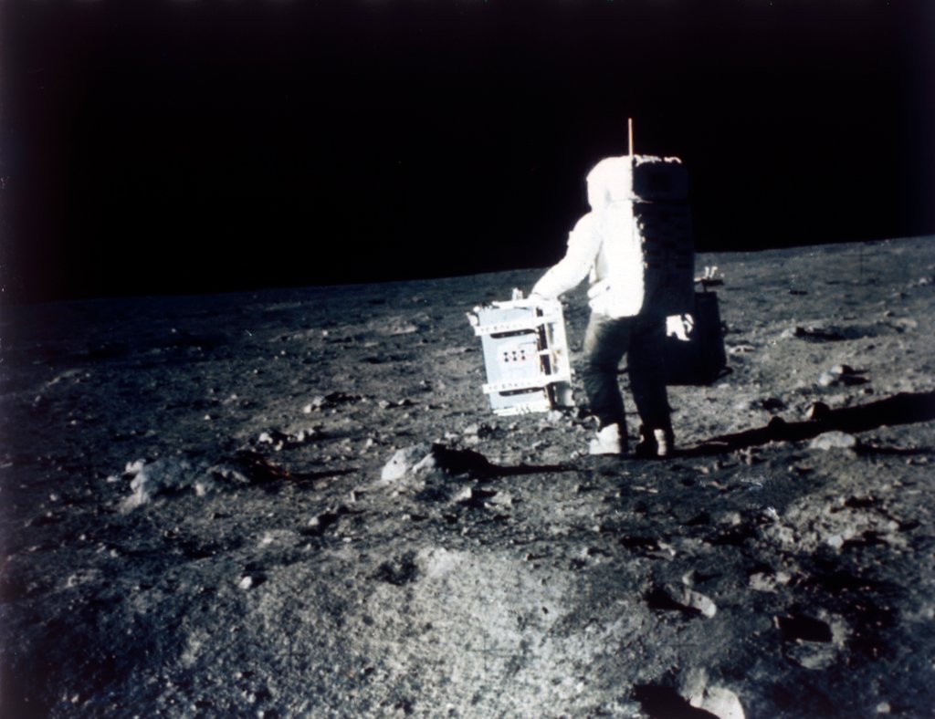 Detail of Buzz Aldrin carries out an experiment on the lunar surface, Apollo II mission, July 1969 by Neil Armstrong