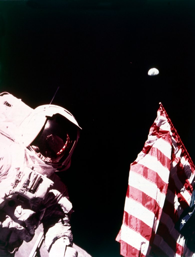 Detail of Harrison Schmitt with US flag on the surface of the Moon, Apollo 17 mission, December 1972 by Eugene Cernan