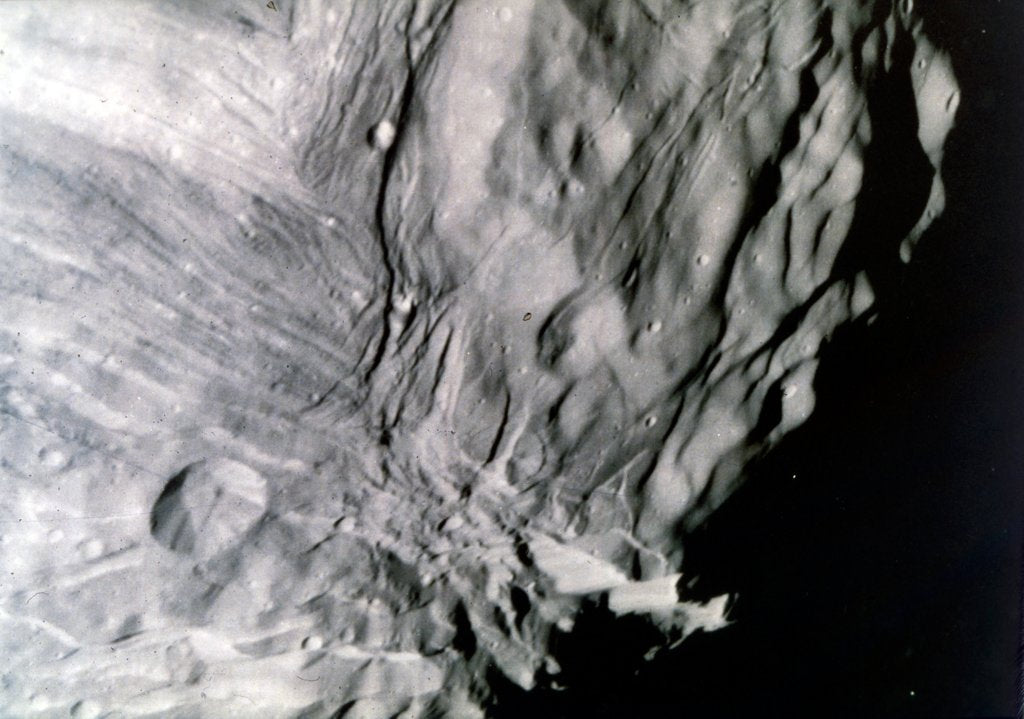 Detail of Miranda, one of the moons of Uranus, seen from Voyager 2, 24 January 1986 by NASA