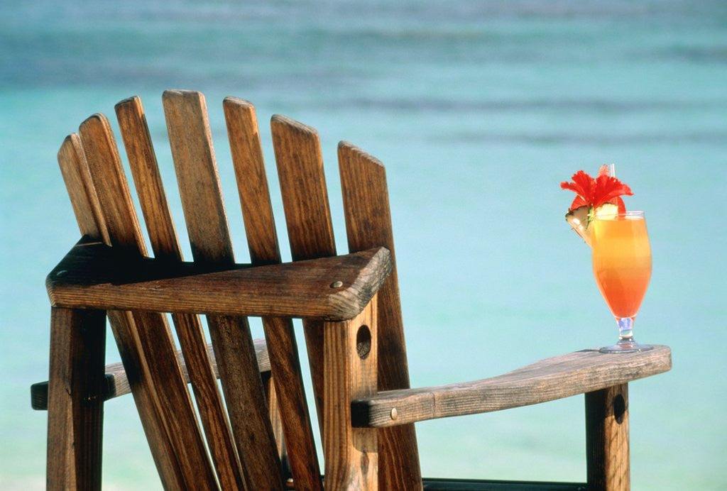 Detail of Seychelles, Denis Island, beach chair and fruit cocktail by Corbis