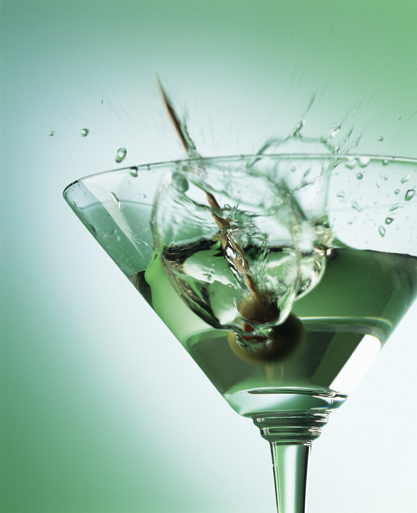 Detail of Martini with Olive Splash by Corbis
