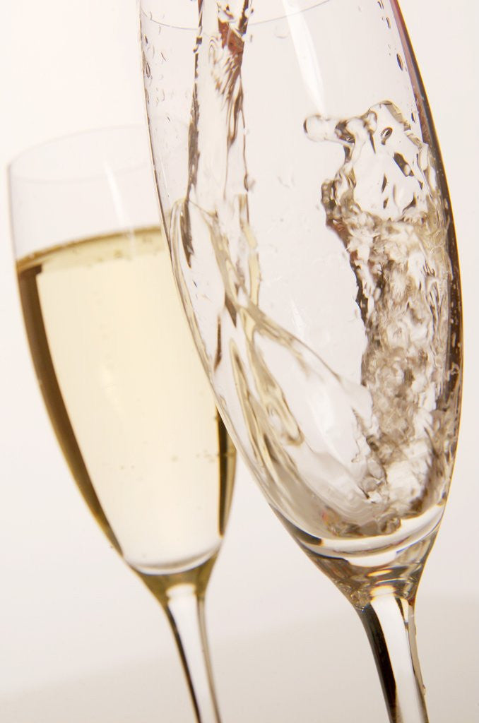 Detail of Champagne being poured into glass by Corbis