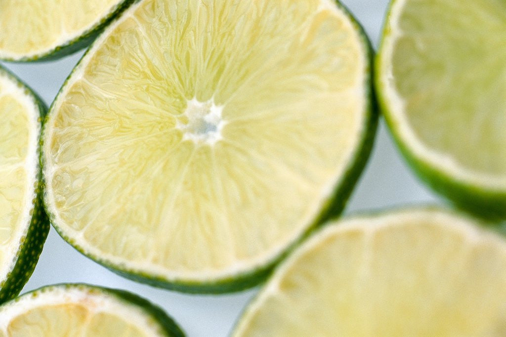 Detail of Limes in slices by Corbis