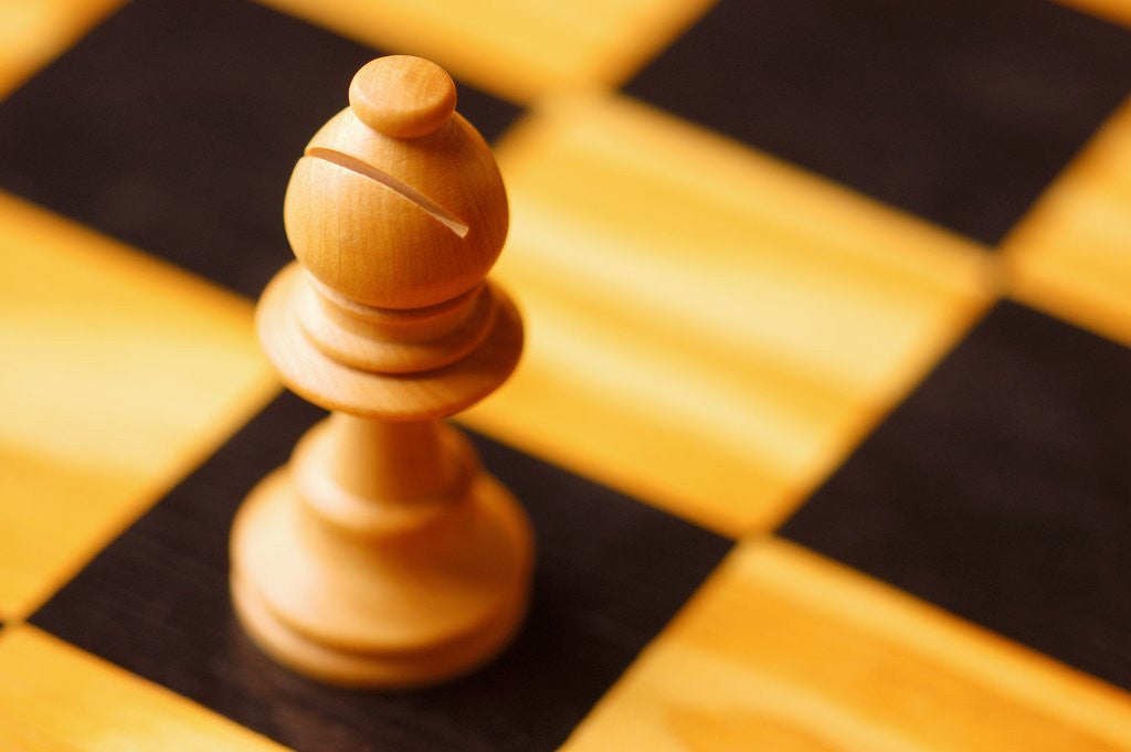 Detail of Pawn on chessboard by Corbis
