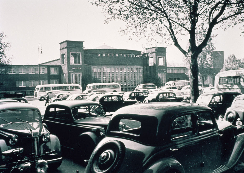 Detail of D / Duesseldorf: Historic picture of the Rheinterrasse building with parking cars by Anonymous