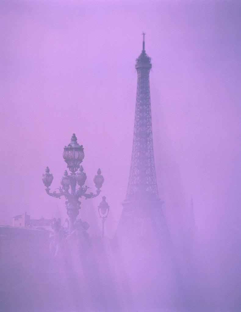 Detail of Eiffel tower and candelabra with fog in Paris by Corbis