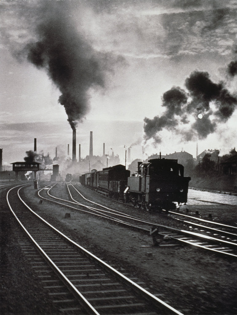 Detail of Freight train in front of smoking chimney stacks, nostalgia by Anonymous