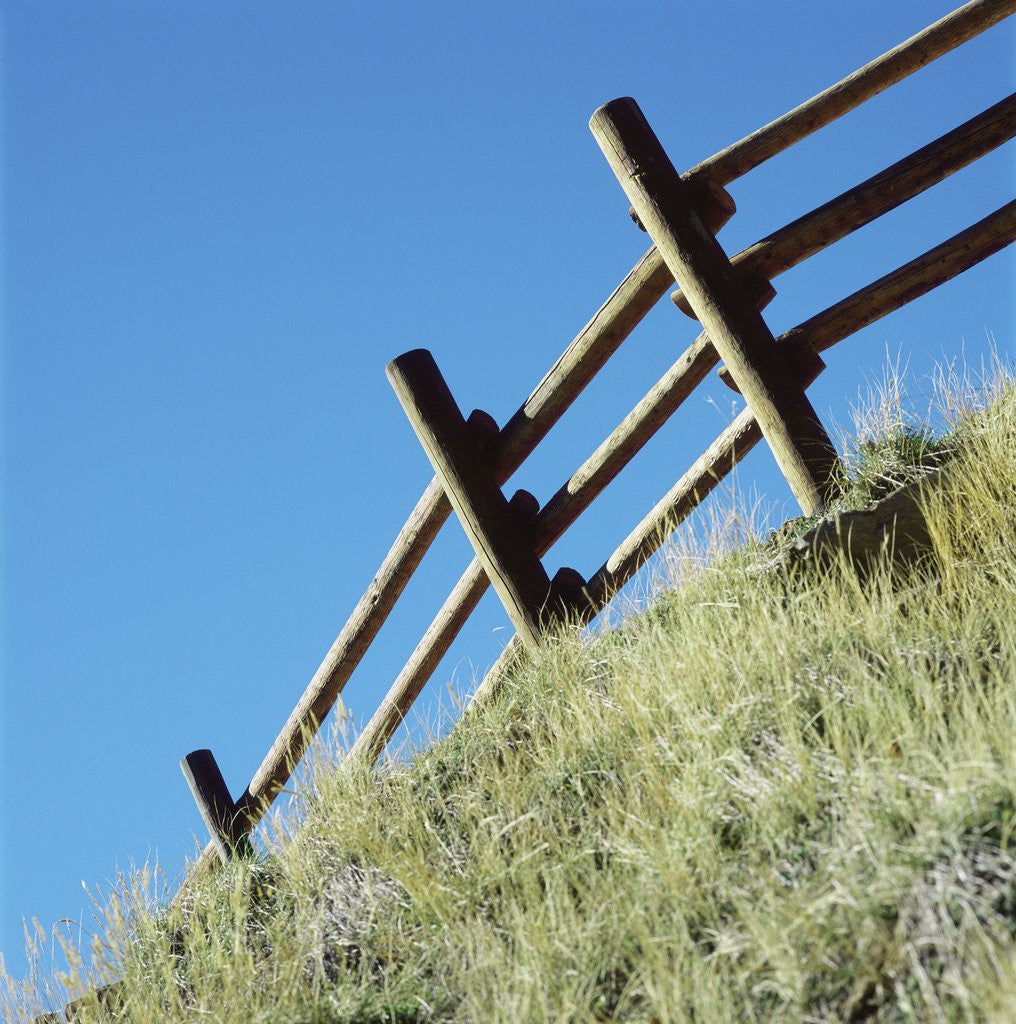 Detail of Low angle view of rustic wooden fence by Anonymous