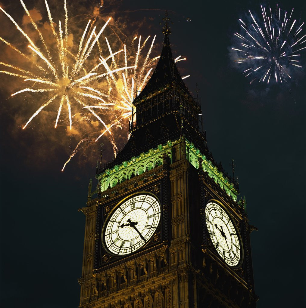 Detail of Low angle view of Big Ben, London, England, with fireworks bursting overhead by Corbis