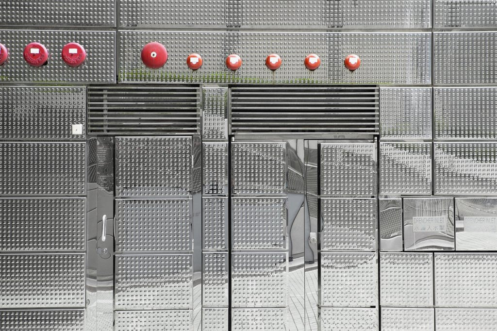 Detail of Abstract view of metal wall with red bells on it by Anonymous