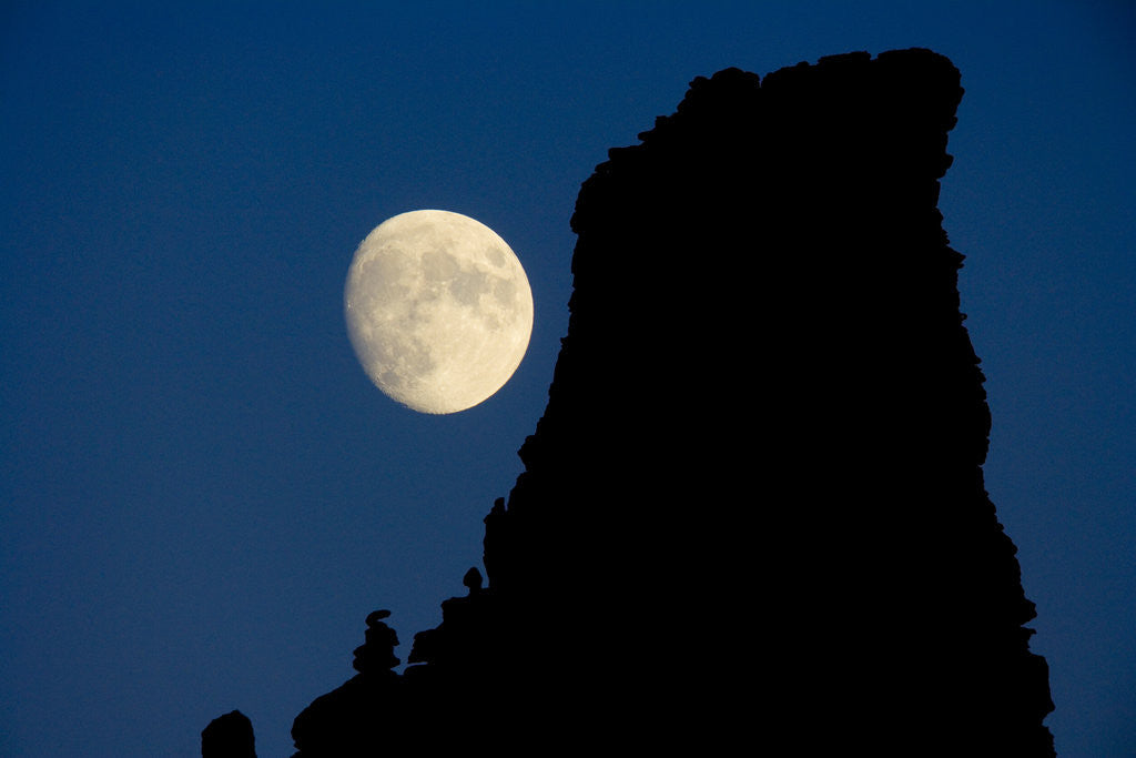 Detail of Full Moon Beside Rock by Corbis