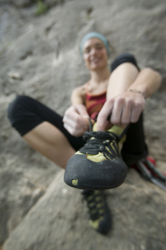 Detail of Woman Putting on Rock Climbing Shoes by Anonymous