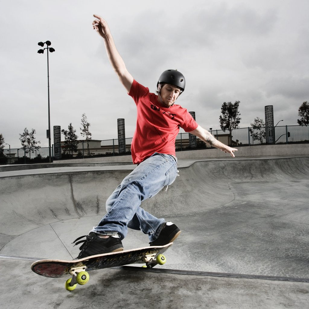 Skateboarder Performing Tricks by Corbis