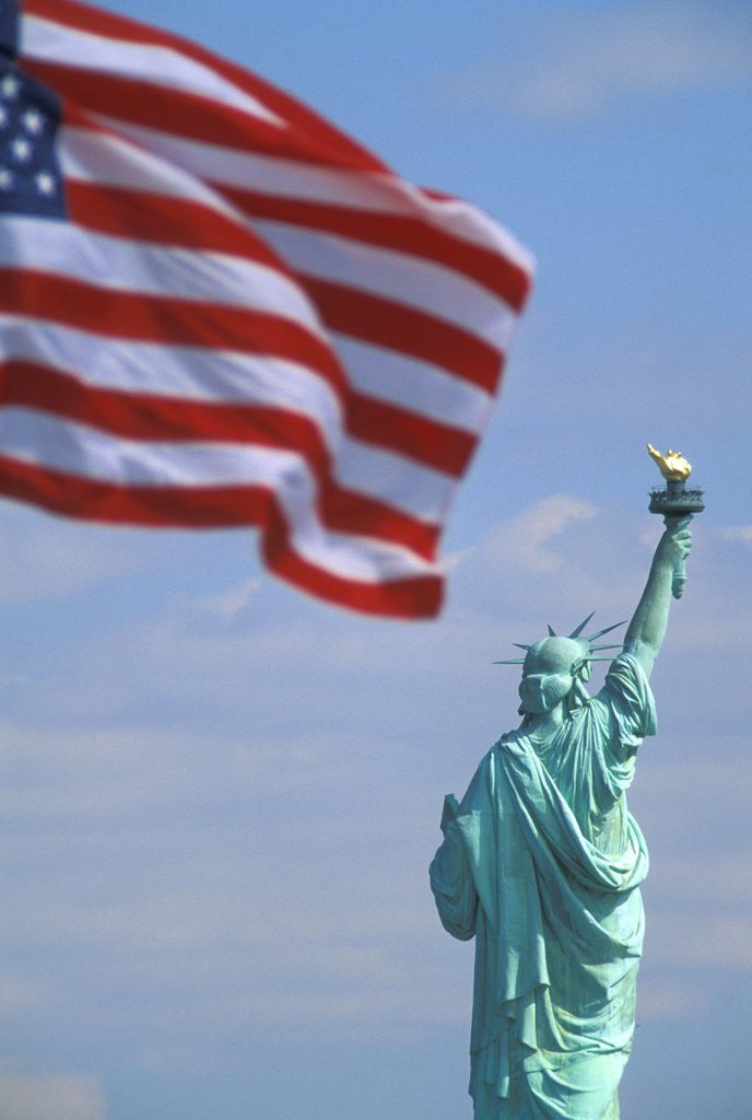 Detail of Statue of Liberty and American Flag by Corbis