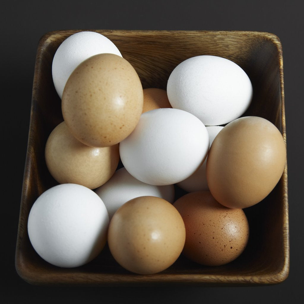 Detail of White and Brown Eggs in Basket by Anonymous