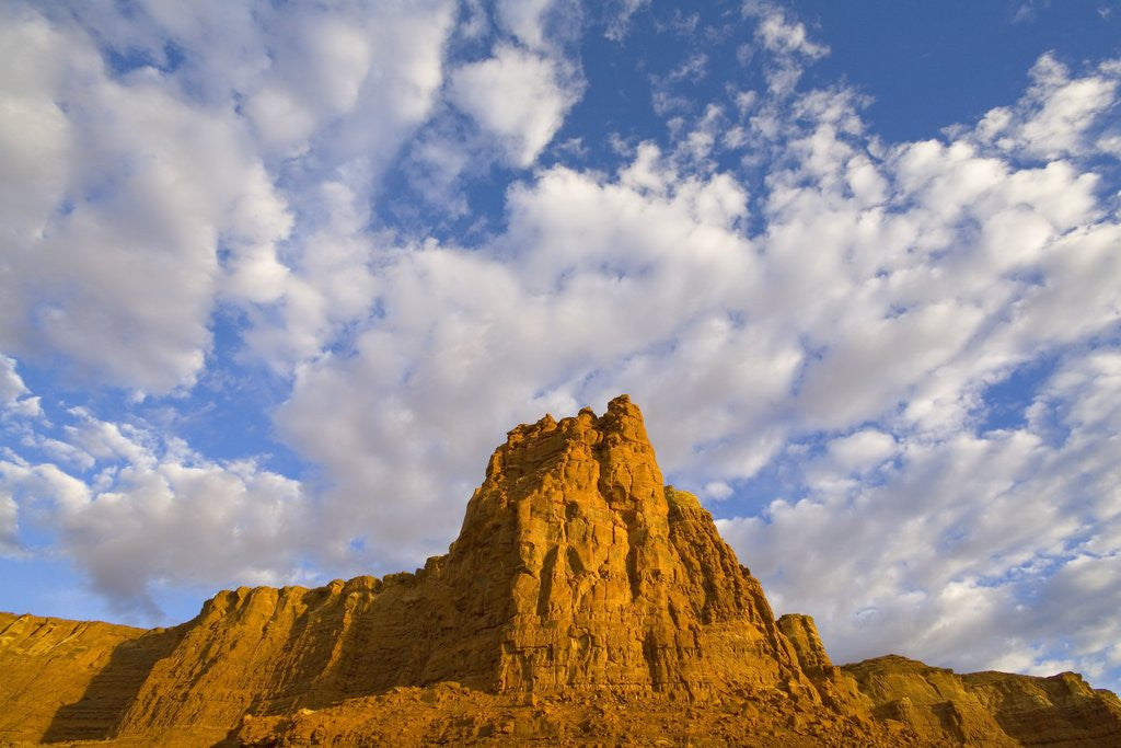 Detail of Cumulus Clouds Over Sandstone Buttes at Sunrise by Corbis