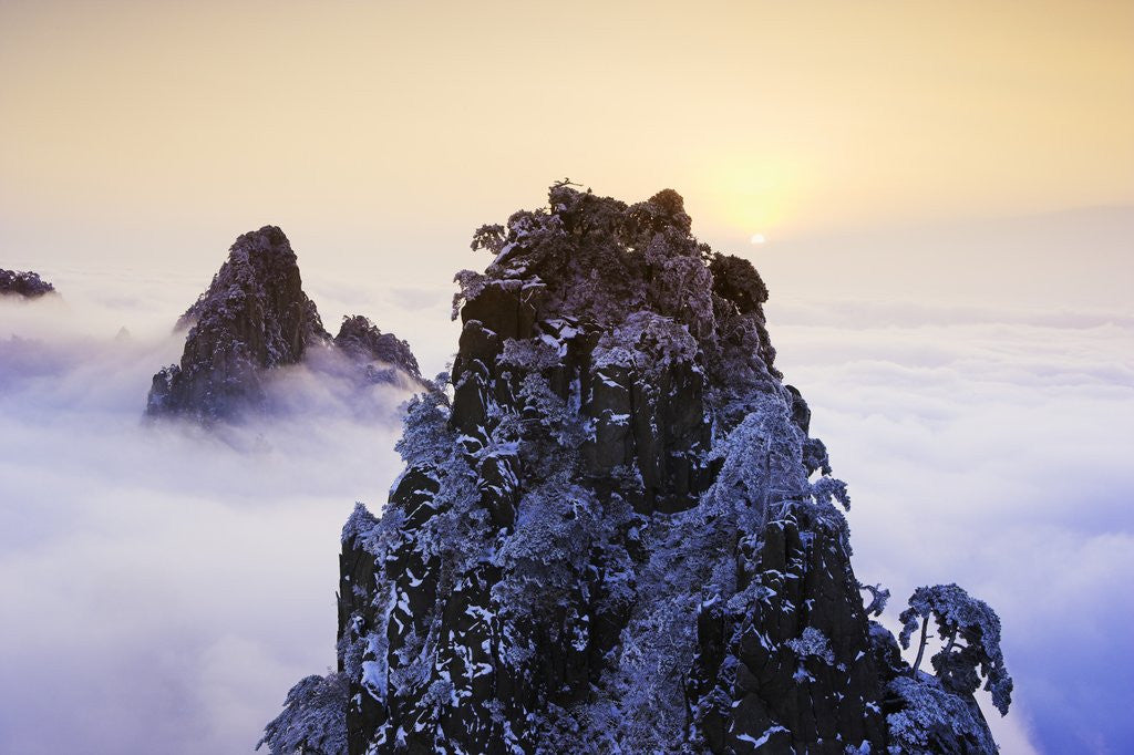 Detail of Mountain Peaks Above Clouds by Corbis