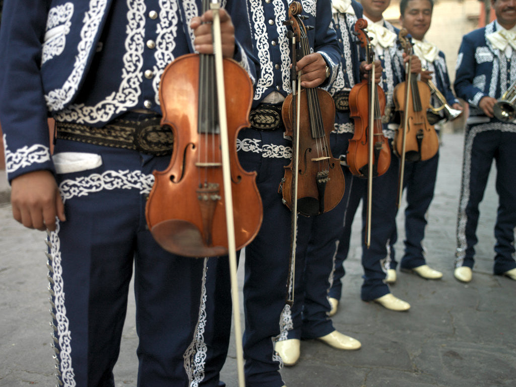 Detail of Mariachi Violin Players Line Up by Corbis