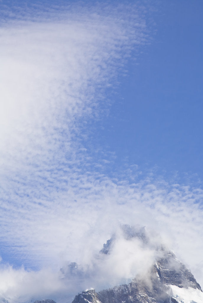 Detail of Cirrocumulus Clouds Above Rocky Crags by Anonymous