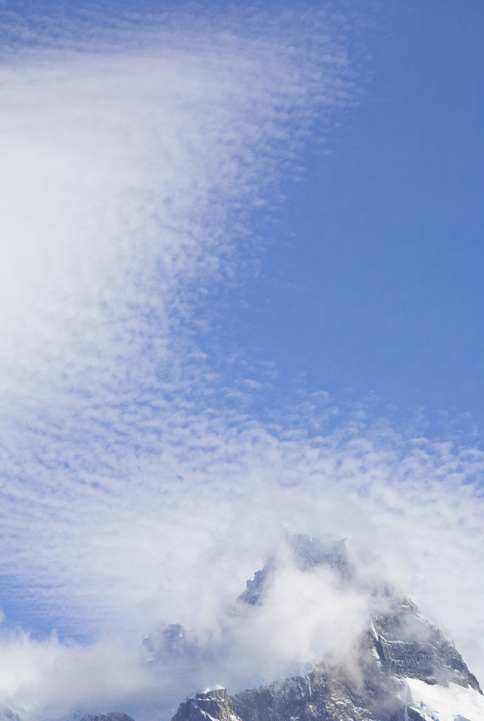 Detail of Cirrocumulus Clouds Above Rocky Crags by Corbis