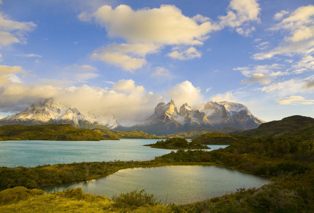 Detail of Mountains Shrouded in Clouds near Lake by Anonymous