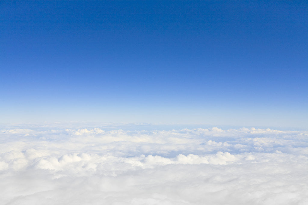Detail of Thick Cumulus Clouds Below Clear Sky by Corbis