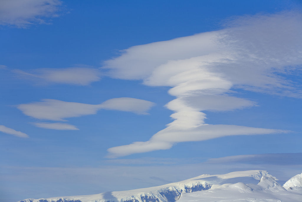 Detail of Lenticular Clouds Floating above Snow-covered Glacier by Anonymous