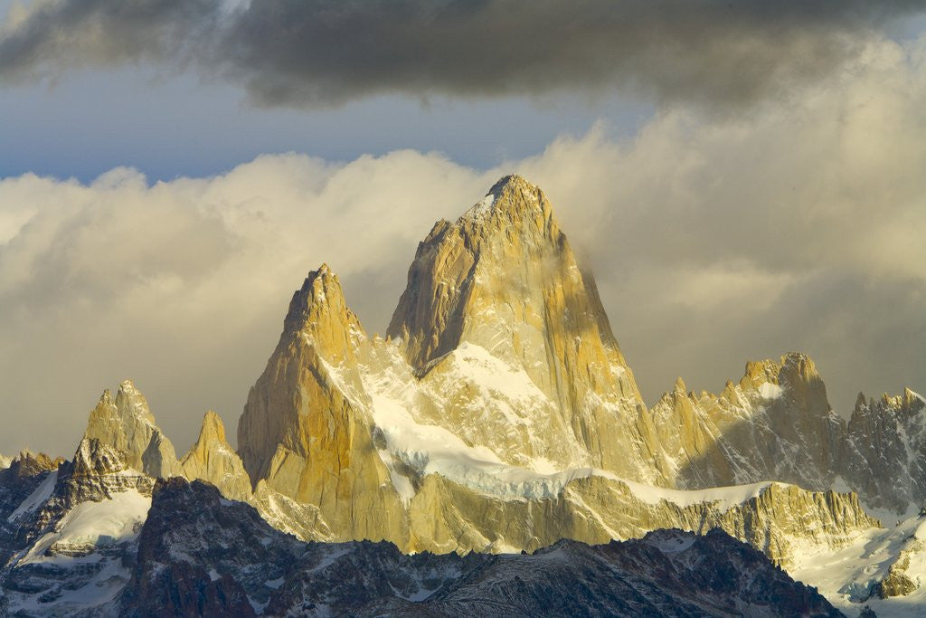 Detail of Fitzroy Massif and Cumulus Clouds at Sunrise by Corbis