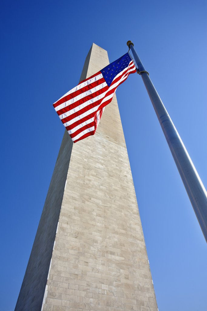 Detail of Washington Monument and American Flag by Corbis