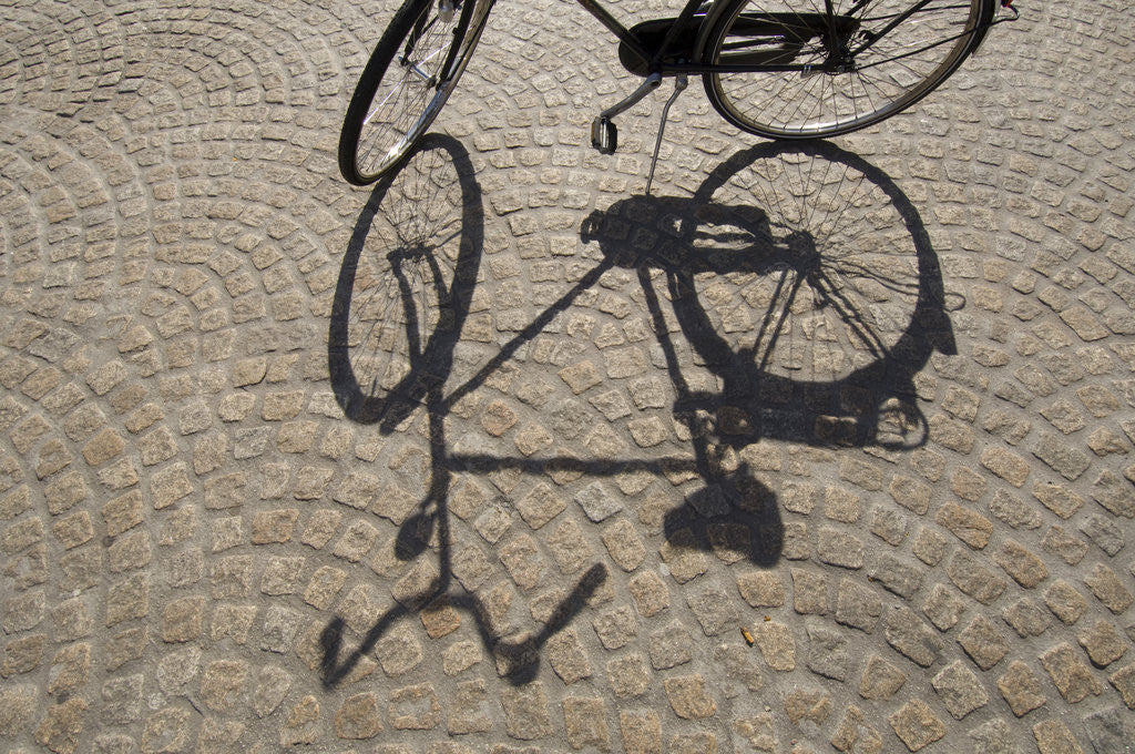 Detail of Bicycle Shadow on Cobblestone by Corbis