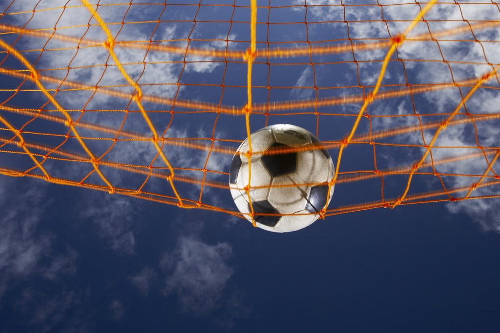Detail of Soccer Ball Going Into Goal Net by Anonymous