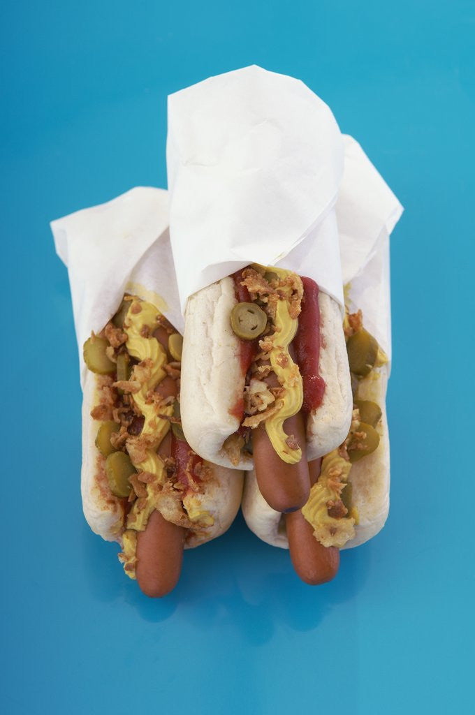 Detail of Three hot dogs in buns by Anonymous