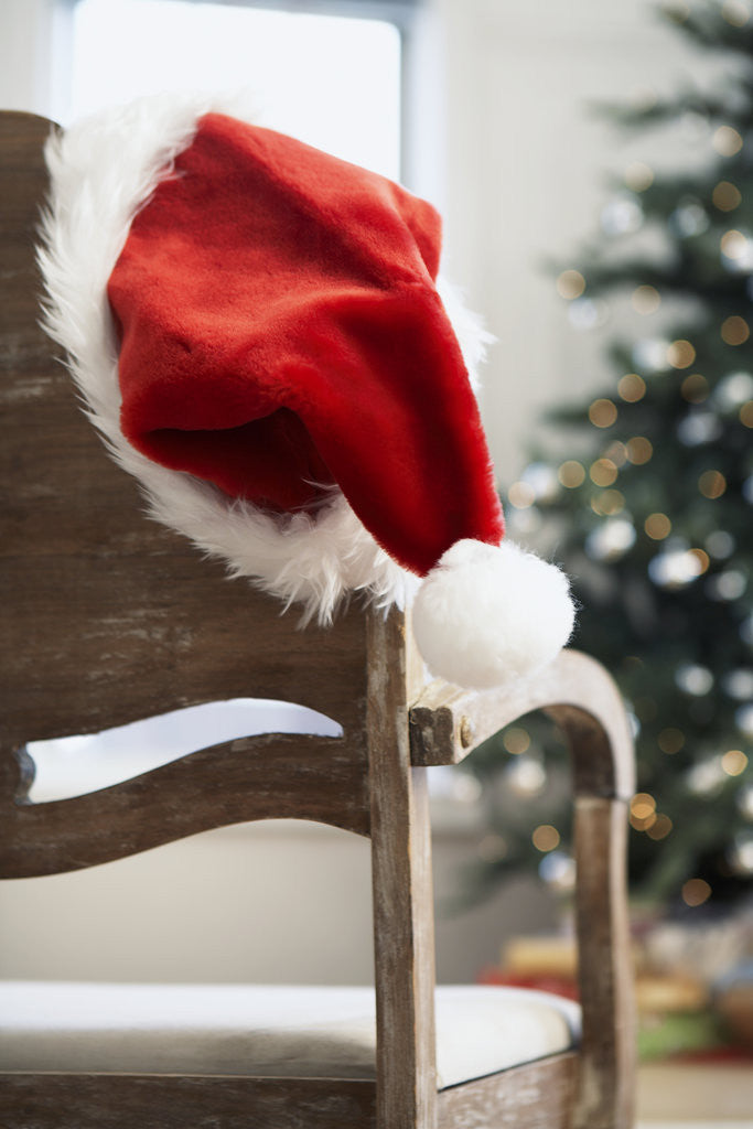 Detail of Santa hat on chair by Corbis