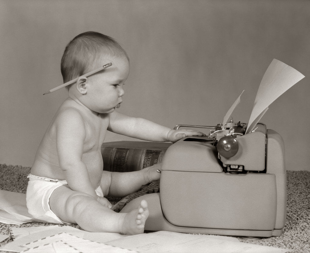 Detail of 1960s Businesslike Baby With Pencil Behind Ear Typing On Typewriter by Anonymous
