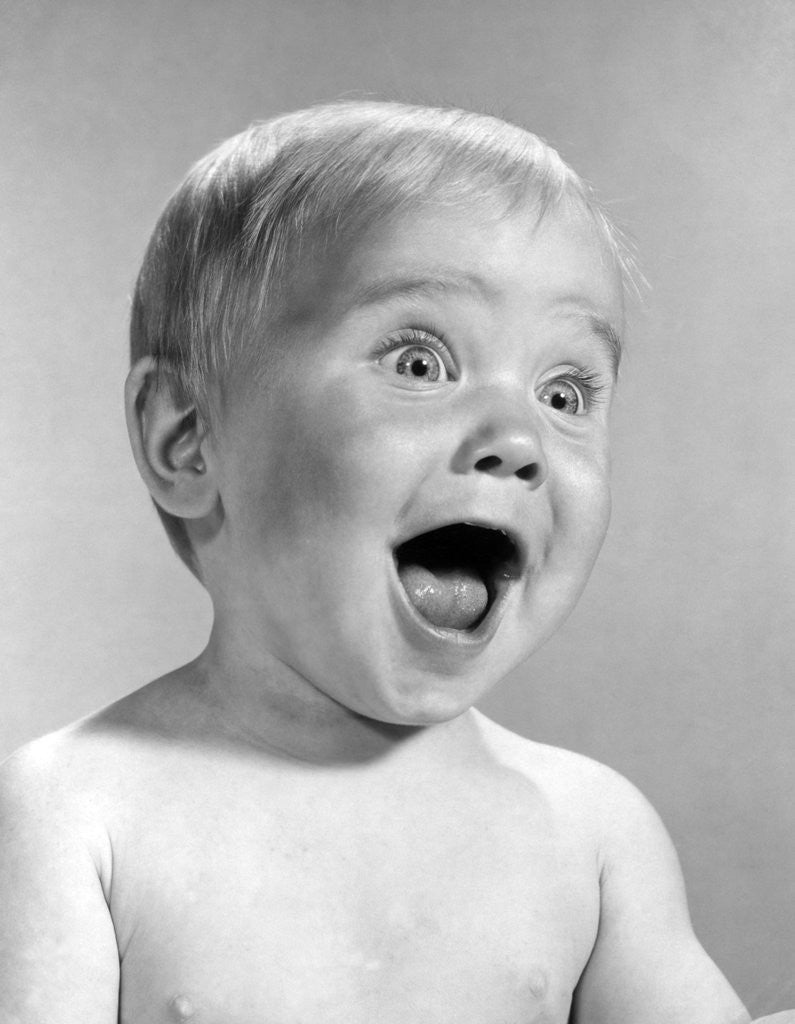 Detail of 1960s Portrait Baby With Eyes And Mouth Wide Open by Anonymous