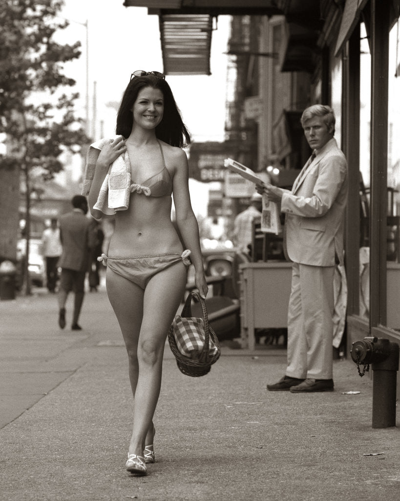 Detail of 1970s Man Ogling Sexy Young Woman Walking Down City Street Wearing Only A Bikini by Anonymous
