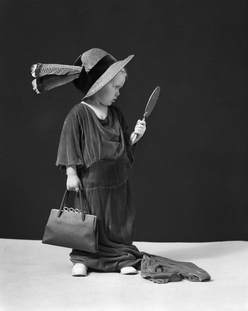 Detail of 1930s 1940s Girl Playing Dress-Up Looking At Herself In Hand Mirror by Anonymous