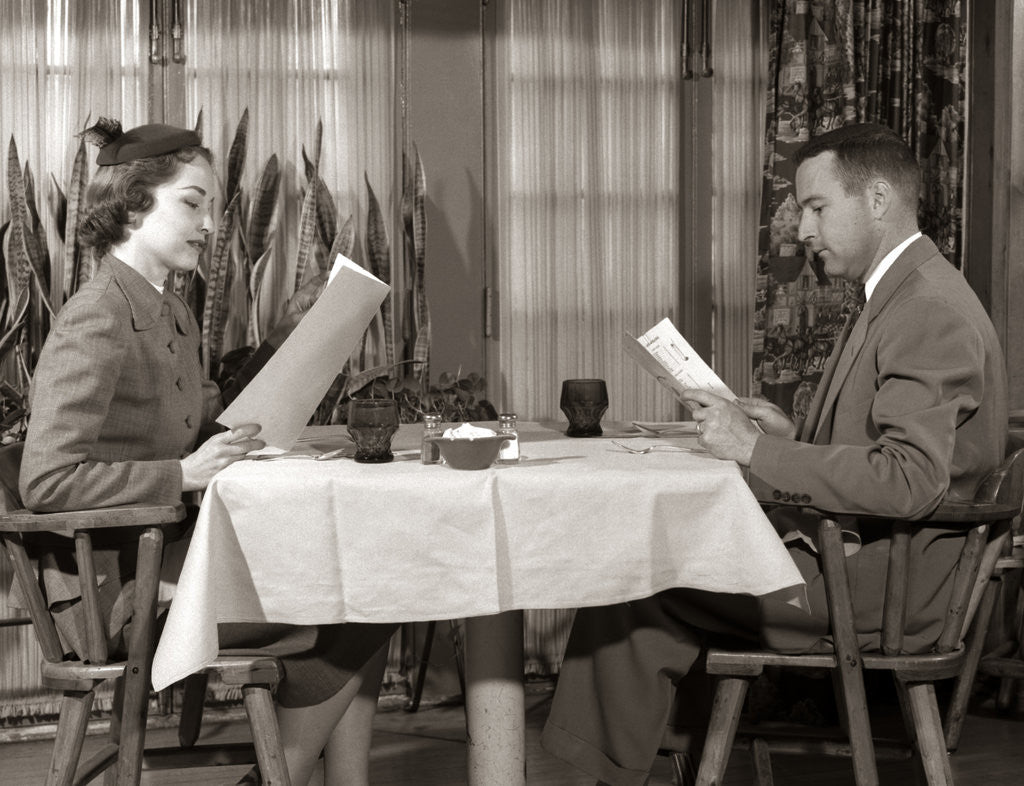 Detail of 1950s Couple Man Woman Reading Restaurant Menus by Anonymous