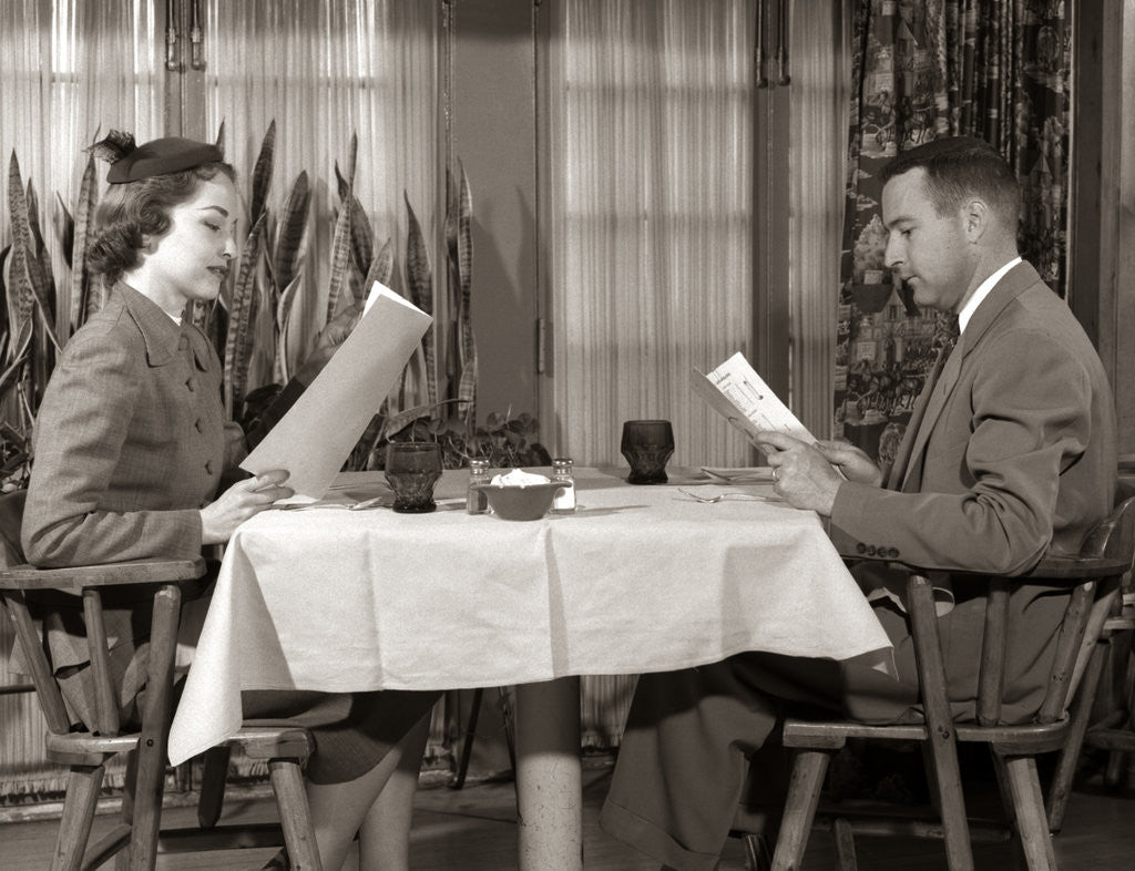 Detail of 1950s Couple Man Woman Reading Restaurant Menus by Corbis