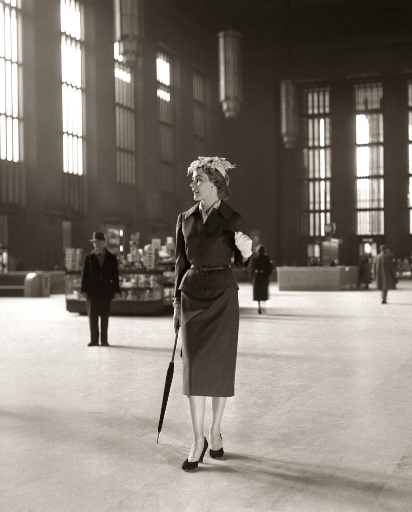 Detail of 1950s Fashionable High Class Woman Alone Train Station Umbrella Waiting Lonely by Corbis