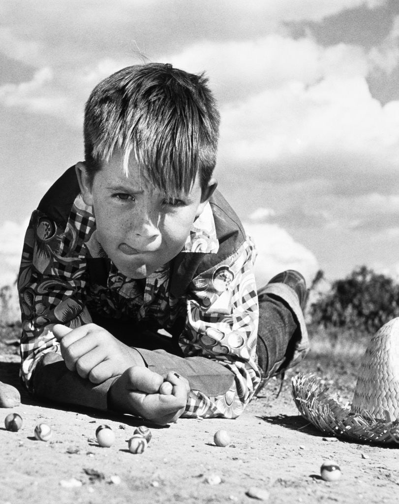 Detail of 1950s Boy Shooting Marbles Outdoor by Corbis