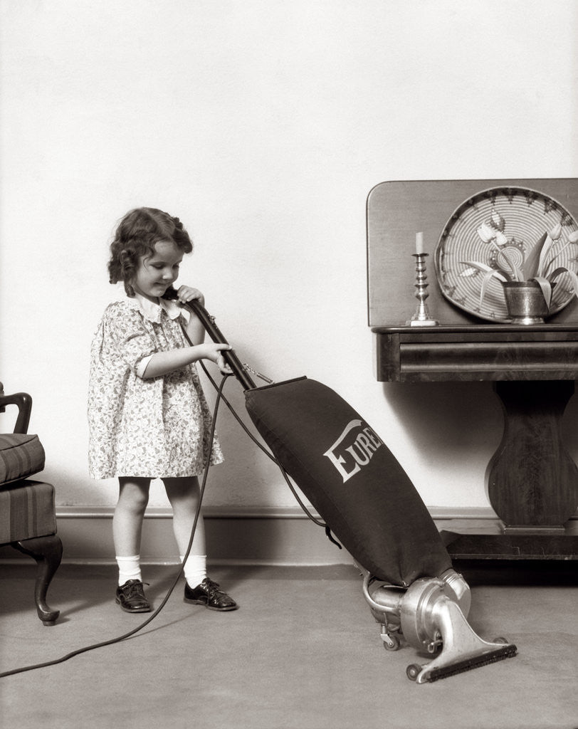 Detail of 1930s Little Girl Vacuuming With Eureka Electric Vacuum Cleaner by Anonymous