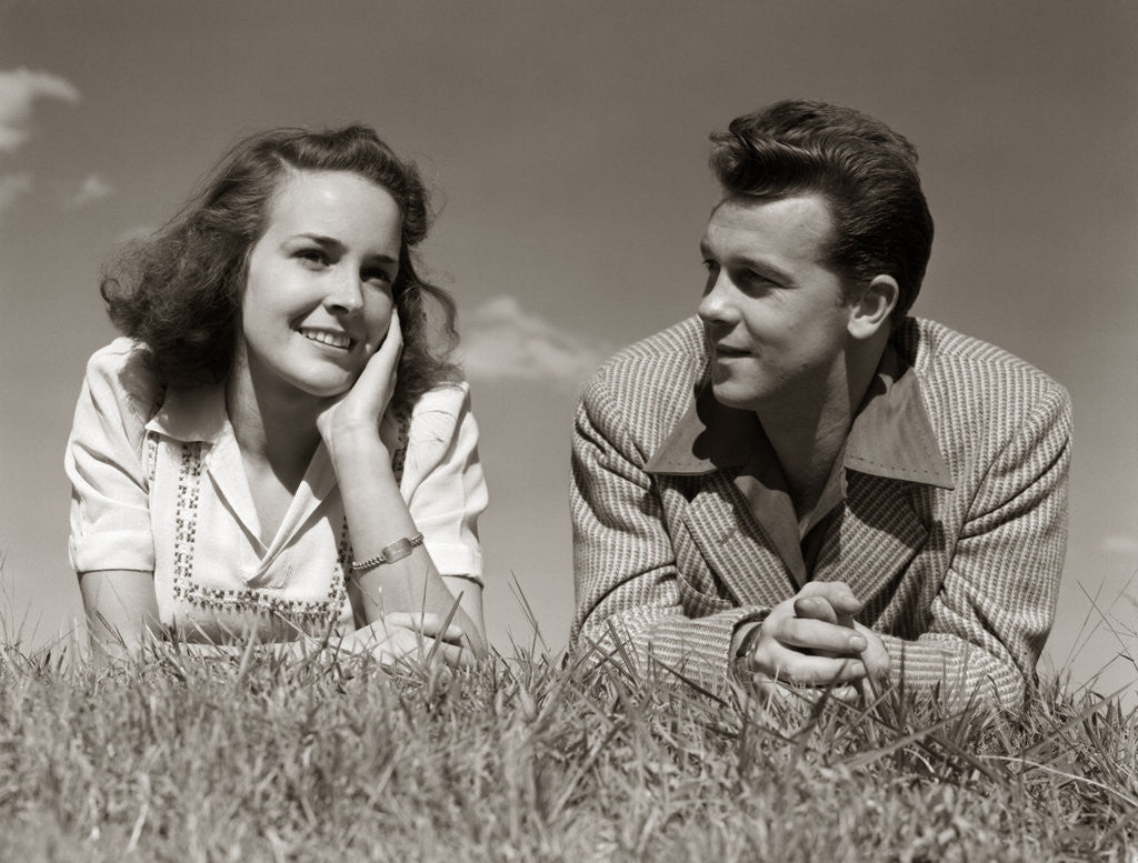 Detail of 1940s Teenage Couple Lying In Grass Romance Boy Girl Outdoor by Anonymous