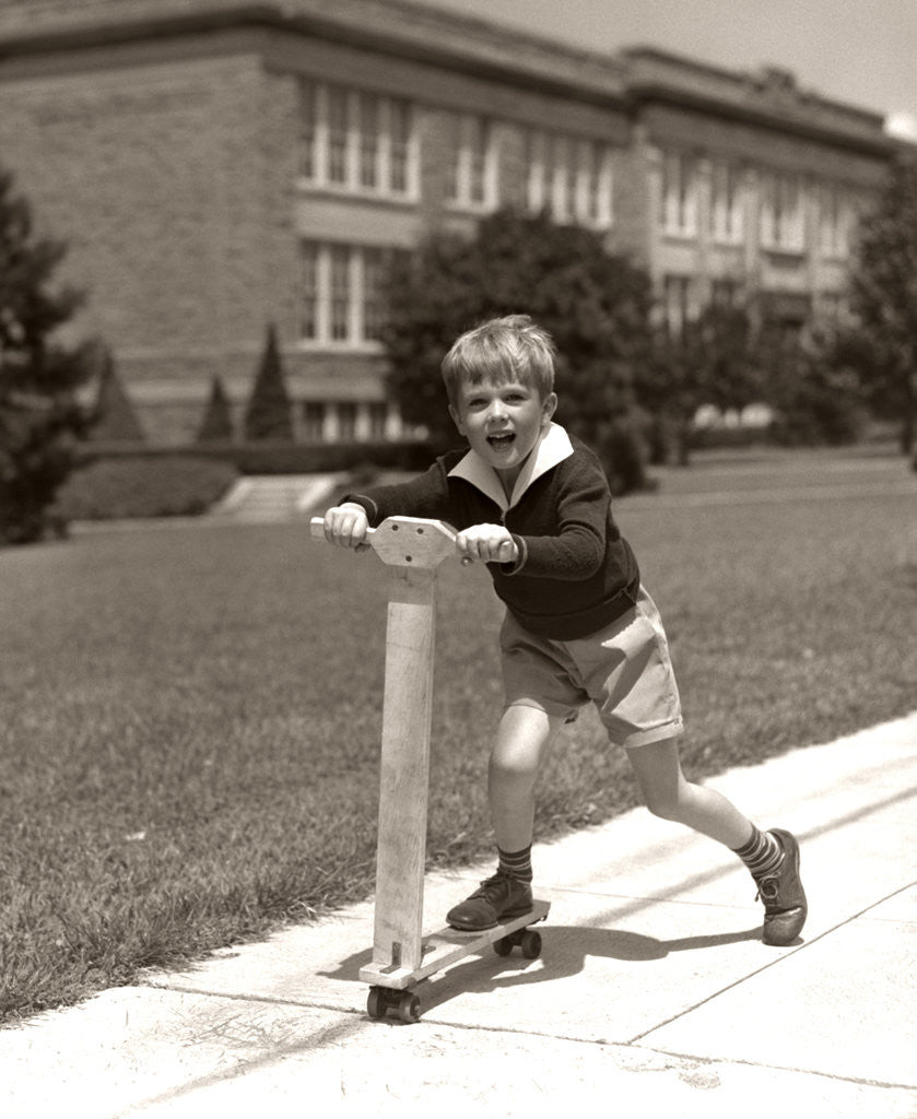Detail of 1930s Boy Outside On Scooter Having Fun by Corbis