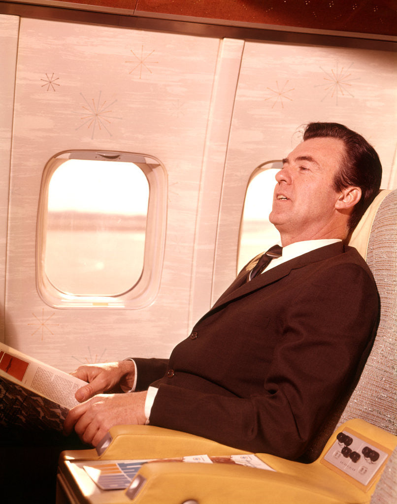 Detail of 1960s Man Sitting In First Class Airplane Passenger Seat by Anonymous
